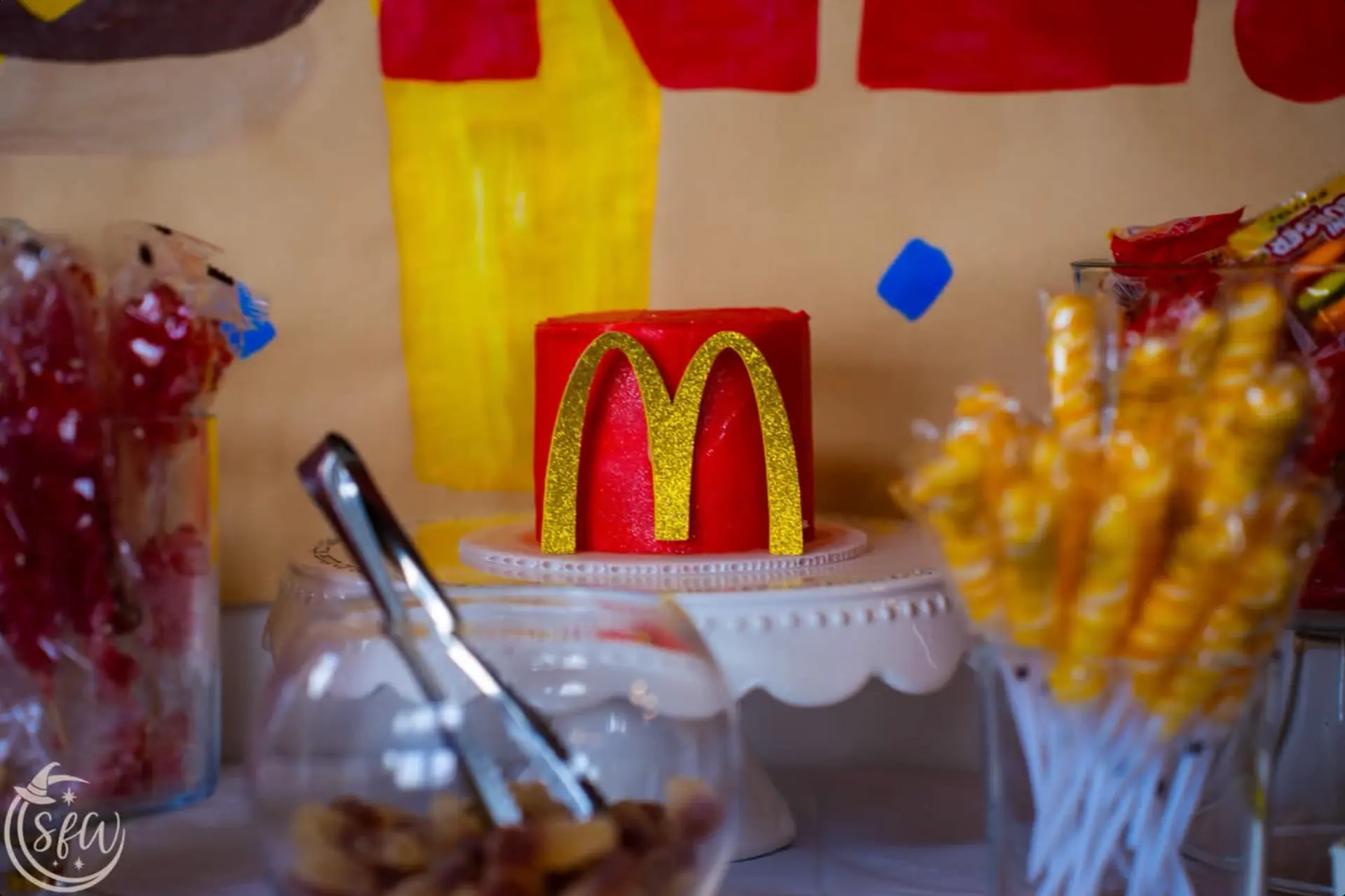 Detail of a small themed birthday cake on a pedestal stand
