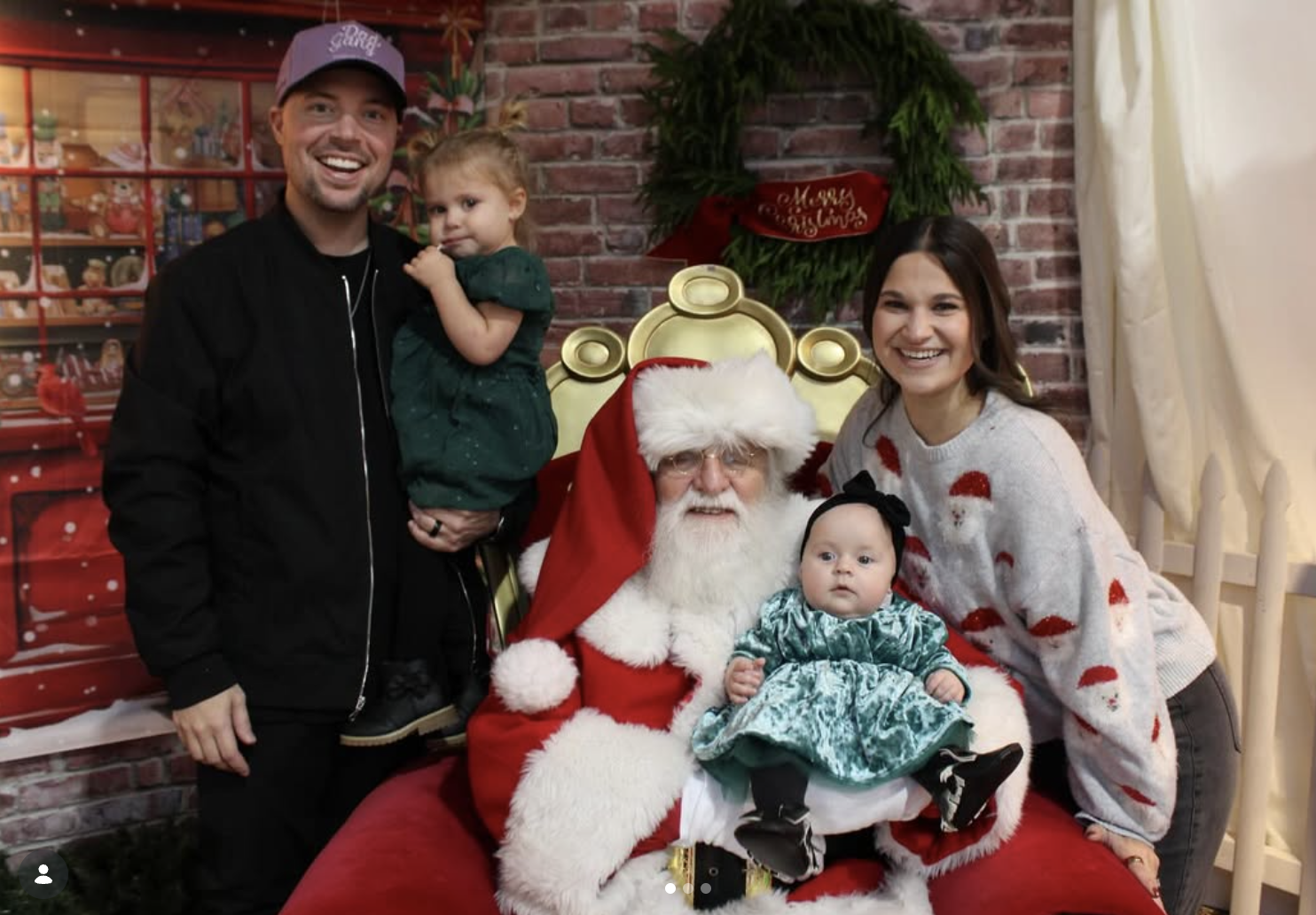 Family holiday portrait with Santa at a Christmas celebration designed by By Design Events
