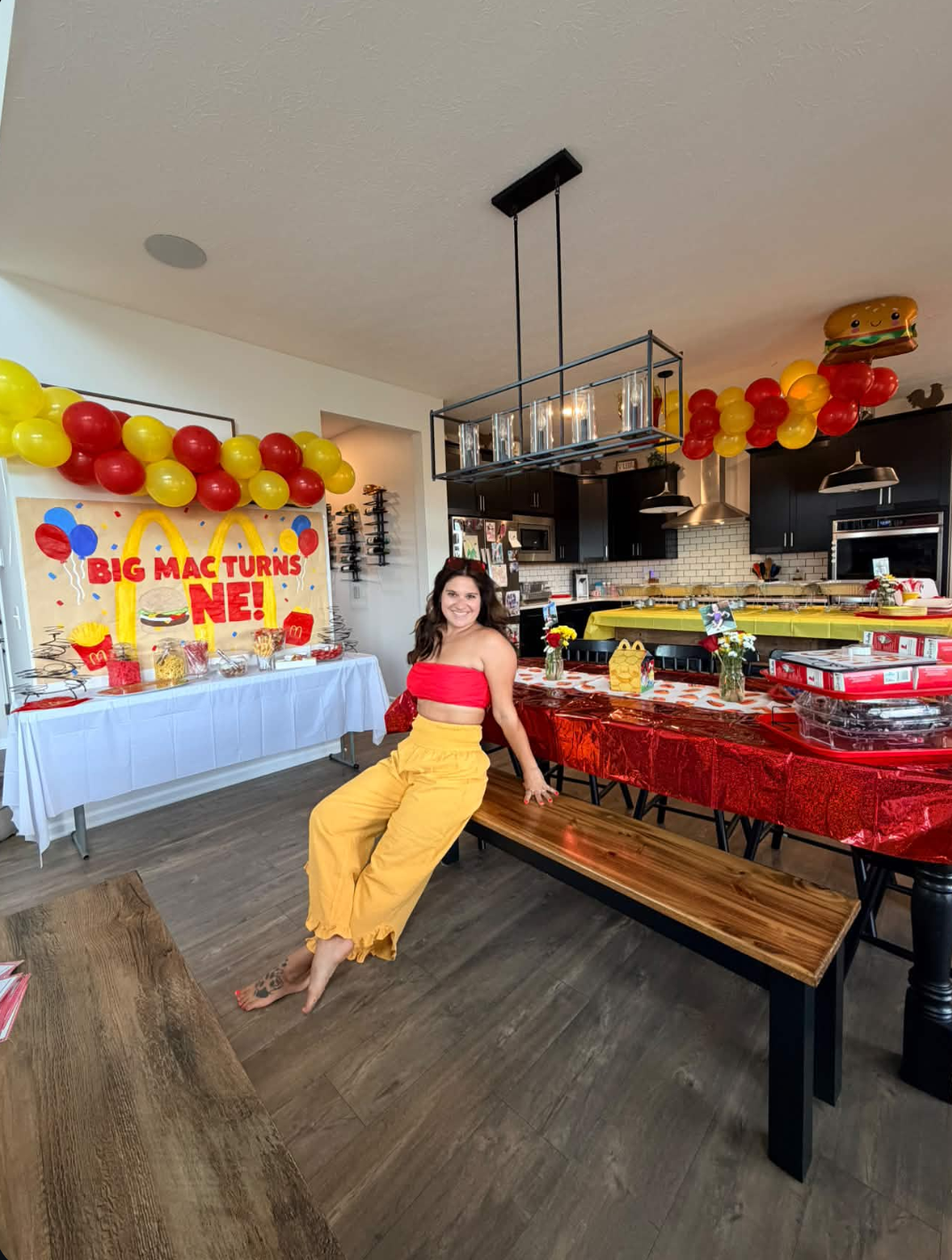 Full themed birthday setup with dessert table, balloon garland and dining tablescape